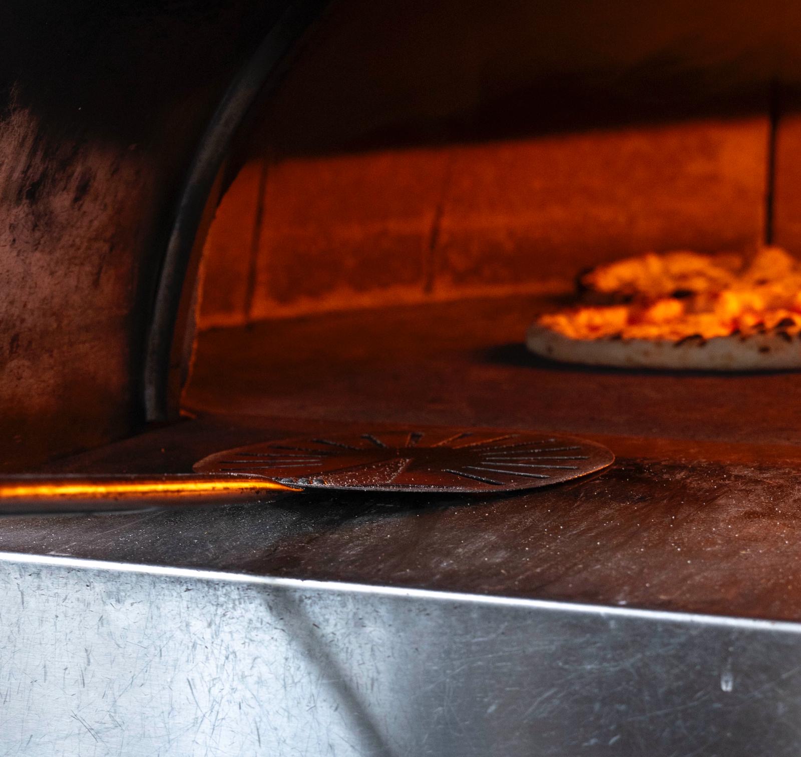 Wood-fired oven at Kalura pizzeria, Antwerp